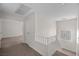 Hallway with carpeted floors that opens up to other rooms at 5458 Walton Heath Ave, Las Vegas, NV 89142