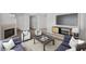 Bright living room featuring modern furniture, fireplace, and contemporary decor at 5458 Walton Heath Ave, Las Vegas, NV 89142