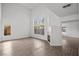 Bright living room featuring a fireplace, high ceilings, and large windows offering ample natural light at 5458 Walton Heath Ave, Las Vegas, NV 89142