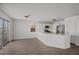 Bright, open living space with stainless steel appliances and wood look floors at 5458 Walton Heath Ave, Las Vegas, NV 89142