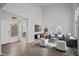 Well-lit living room with high ceilings, features a TV, modern furniture and an open floor plan at 5458 Walton Heath Ave, Las Vegas, NV 89142