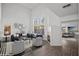 Inviting living room with high ceilings and bright, neutral paint, showcasing a fireplace and stylish decor at 5458 Walton Heath Ave, Las Vegas, NV 89142