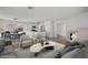 Spacious living area with dining area and kitchen in the background, all virtually staged at 5458 Walton Heath Ave, Las Vegas, NV 89142