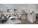 Bright open concept living and dining area with lots of natural light from multiple windows at 5458 Walton Heath Ave, Las Vegas, NV 89142