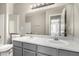Bright bathroom showcasing a double sink vanity and a large mirror at 5734 Duval Dr, Las Vegas, NV 89156