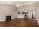 Inviting open-concept space with a fireplace, wood floors, and an adjacent kitchen at 5734 Duval Dr, Las Vegas, NV 89156