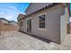 Low-maintenance backyard with large patio and textured wall at 6106 Castle Gardens Ave, Las Vegas, NV 89130
