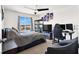 Bright bedroom setup for work and sleep with large window views at 6106 Castle Gardens Ave, Las Vegas, NV 89130
