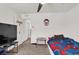 Light-filled bedroom with neutral walls and carpet and fun decorations at 6106 Castle Gardens Ave, Las Vegas, NV 89130