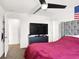 Well-lit bedroom with comfortable bed, closet access, and modern ceiling fan at 6106 Castle Gardens Ave, Las Vegas, NV 89130