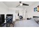 This modern bedroom has large windows, a ceiling fan, and ample storage at 6106 Castle Gardens Ave, Las Vegas, NV 89130