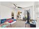 Bright bedroom features a ceiling fan, closet, and playful decor at 6106 Castle Gardens Ave, Las Vegas, NV 89130