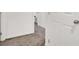 Carpeted hallway featuring neutral color scheme and white trim at 6106 Castle Gardens Ave, Las Vegas, NV 89130