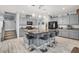 Modern kitchen featuring a large island with bar seating and stainless steel appliances at 6106 Castle Gardens Ave, Las Vegas, NV 89130
