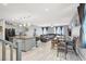 Open-concept living space seamlessly connects the kitchen, dining, and living areas at 6106 Castle Gardens Ave, Las Vegas, NV 89130