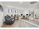 Bright loft space features multiple workstations and comfortable seating with carpet at 6106 Castle Gardens Ave, Las Vegas, NV 89130