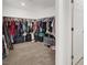 Large walk-in closet features custom shelving, hanging rods, and ample storage space at 6106 Castle Gardens Ave, Las Vegas, NV 89130