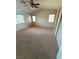Spacious bedroom features vaulted ceilings, neutral walls, plush carpeting, and abundant natural light at 6425 Sierra Sands St, North Las Vegas, NV 89086