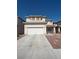 Inviting two-story home with a two-car garage and low-maintenance desert landscaping at 6425 Sierra Sands St, North Las Vegas, NV 89086