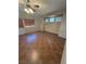 Spacious living room with high ceilings, neutral walls and updated tile floors at 6425 Sierra Sands St, North Las Vegas, NV 89086