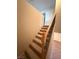 Carpeted stairway with wooden railing at 6425 Sierra Sands St, North Las Vegas, NV 89086