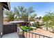 Balcony view of lush lawn, mature trees, and outdoor lounge area at 7135 Polaris Ave, Las Vegas, NV 89118