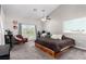 Spacious bedroom with a ceiling fan, large window, and glass doors to the outside at 7135 Polaris Ave, Las Vegas, NV 89118