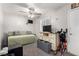 Cozy bedroom with a ceiling fan, natural light and a comfortable daybed at 7135 Polaris Ave, Las Vegas, NV 89118