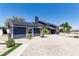 Attractive home featuring solar panels, a walkway, and desert landscaping in the front yard at 7135 Polaris Ave, Las Vegas, NV 89118