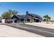 Charming home with solar panels, a driveway, and an attached two-car garage at 7135 Polaris Ave, Las Vegas, NV 89118