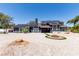 Stunning two-story home with solar panels, a fire pit, and a desert-landscaped front yard at 7135 Polaris Ave, Las Vegas, NV 89118