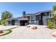 Beautiful home with solar panels, a balcony, and desert-style landscaping at 7135 Polaris Ave, Las Vegas, NV 89118