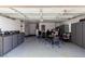 Spacious garage featuring a clean epoxy floor and ample storage cabinets at 7135 Polaris Ave, Las Vegas, NV 89118