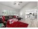 Open-concept living room showcasing windows, a large sectional, and a view to the kitchen at 7135 Polaris Ave, Las Vegas, NV 89118