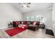Bright living room with vaulted ceilings, a plush sectional, and stylish decor at 7135 Polaris Ave, Las Vegas, NV 89118