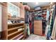 Well-organized walk-in closet with custom shelving, hanging rods, and storage drawers at 7135 Polaris Ave, Las Vegas, NV 89118