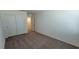 Bedroom with a double door closet, neutral carpet, and white walls at 7375 Davenbury St, Las Vegas, NV 89113