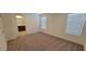This bedroom features neutral walls, carpet flooring and an ensuite bath behind the open doorway at 7375 Davenbury St, Las Vegas, NV 89113