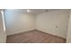 Bedroom with neutral carpet, a window, and a door at 7375 Davenbury St, Las Vegas, NV 89113