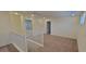 Bright hallway with neutral carpet and natural light from a window at 7375 Davenbury St, Las Vegas, NV 89113