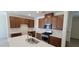 Open kitchen featuring an island, stainless steel appliances, and tile backsplash at 7375 Davenbury St, Las Vegas, NV 89113