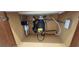 Clean under-sink plumbing featuring disposal, filter and other connections at 7375 Davenbury St, Las Vegas, NV 89113