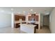 Bright kitchen with white countertops, stainless steel appliances, and dark wood cabinets at 7375 Davenbury St, Las Vegas, NV 89113