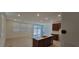 Open floorplan connects living room and kitchen areas with bright light at 7375 Davenbury St, Las Vegas, NV 89113