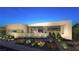 Modern exterior showcasing clean lines, desert landscaping, and unique architectural elements at 7390 Heron Canyon Ct, Las Vegas, NV 89117
