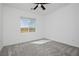 Light and airy bedroom with neutral walls, carpet, ceiling fan, and window at 7777 Vino Vranec Ct, Las Vegas, NV 89113