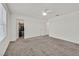 Bedroom with neutral carpeting with windows and access to closet and other rooms at 8011 Cavazzo Ave, Las Vegas, NV 89178