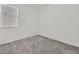 Bedroom with neutral carpeting and window at 8011 Cavazzo Ave, Las Vegas, NV 89178
