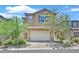 Charming two-story home featuring a tile roof, a two-car garage and a low maintenance landscaped front yard at 8011 Cavazzo Ave, Las Vegas, NV 89178