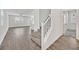 Open-concept living space with wood flooring and a staircase leading to the second floor at 8011 Cavazzo Ave, Las Vegas, NV 89178